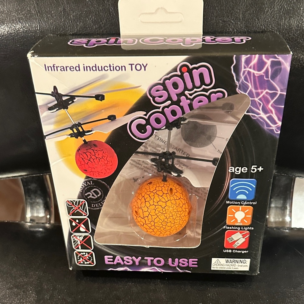 NWT spin copter, motion control, usb charger, easy to use
